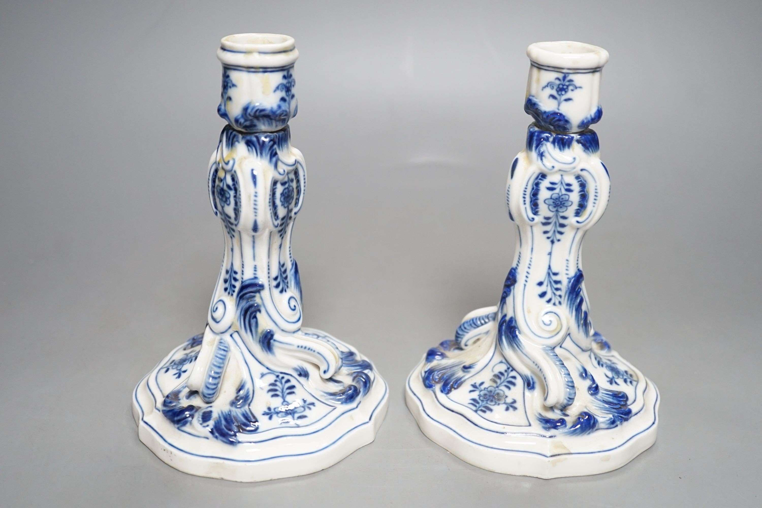 A pair of late 19th century blue and white Meissen onion pattern candlesticks - 17cm tall